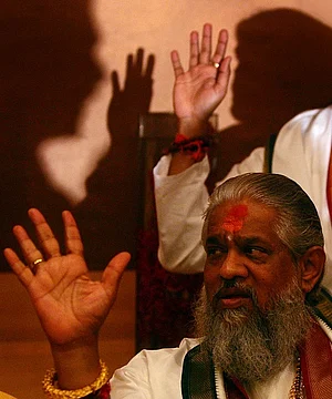 Photo by Ritesh Uttamchandani via Getty Images) : Chandraswami gestures during a press meet in Mumbai on Tuesday. the controversial Godman strongly opposed the Indian Governments decision to establish a trade route between India and Sri Lanka and advocated the preservetion of the Ram Setu which is believed to have been built by Lord Ram. (