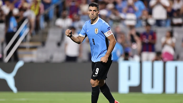 Luis Suarez celebrates after scoring his penalty - null