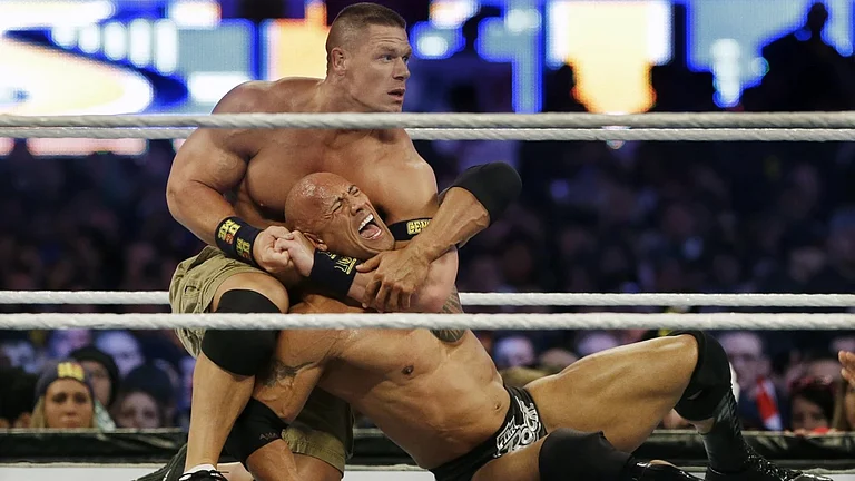WWE's John Cena in action against The Rock. - AP