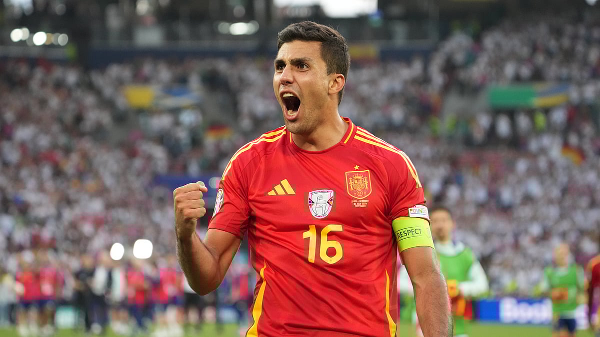 Rodri celebrates Spain's extra-time win over Germany at Euro 2024.