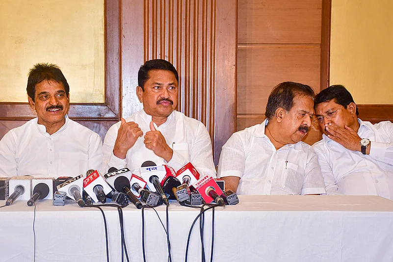 KC Venugopal, Ramesh Chennithala and Nana Pathole (2nd L) at a press conference in Mumabai
