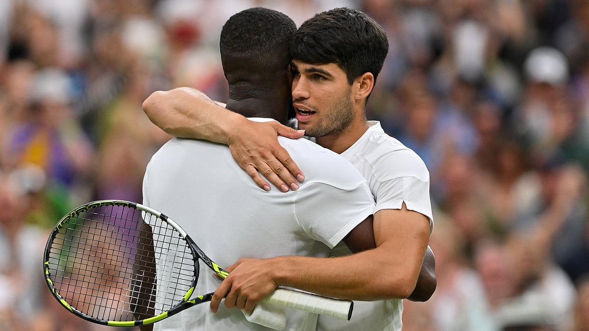 Carlos Alcaraz and Frances Tiafoe after their Wimbledon classic.