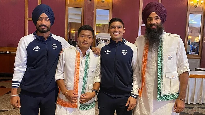 Indias Paris-bound athletes in Indian jersey.