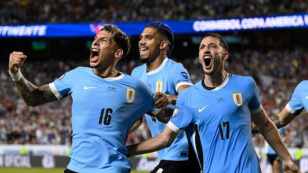 Photo: AP/ : Uruguay celebrate after scoring a goal