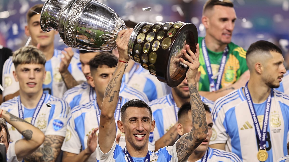 Angel Di Maria lifts the Copa America trophy.