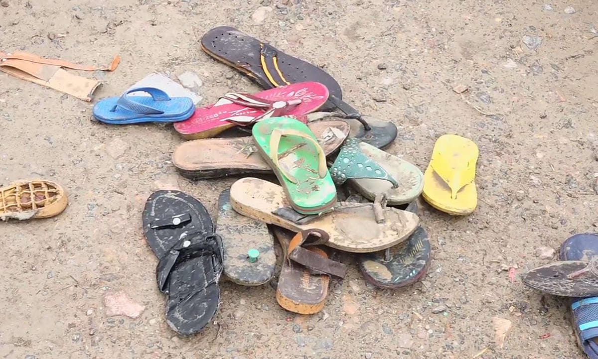 Footwears lying at the scene a day after a massive stampede that took during a 'satsang' (religious congregation), in Sikandara Rao area in Hathras district, Wednesday, July 3, 2024. - PTI