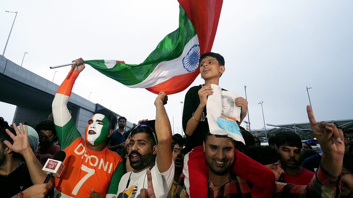 PTI : Fans outside Delhi airport to welcome Indian team.