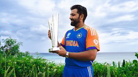 Rohit Sharma looking at the T20 WC trophy.