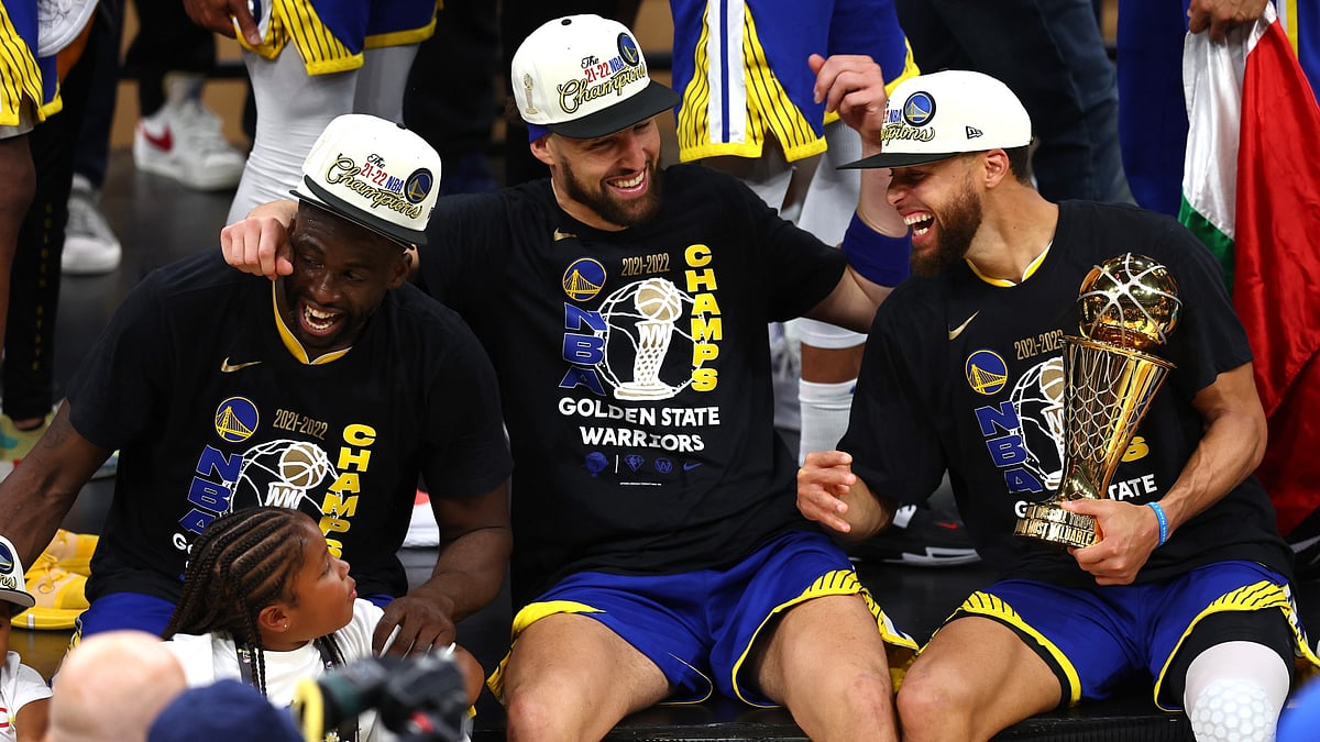 Draymond Green, Klay Thompson and Stephen Curry celebrate the Golden State Warriors' 2022 NBA championship. - null