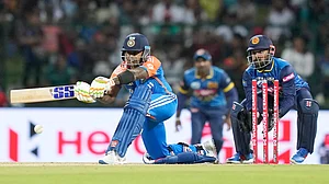 AP Photo/Eranga Jayawardena : India's captain Suryakumar Yadav plays a shot during the first Twenty20 cricket match between Sri Lanka and India in Pallekele, Sri Lanka.
