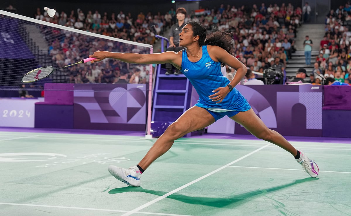 Paris: India's PV Sindhu returns to Estonia's Kristin Kuuba during the women's singles group play stage badminton match at the Summer Olympics 2024, in Paris, France, Wednesday, July 31, 2024.

 - PTI/Ravi Choudhary