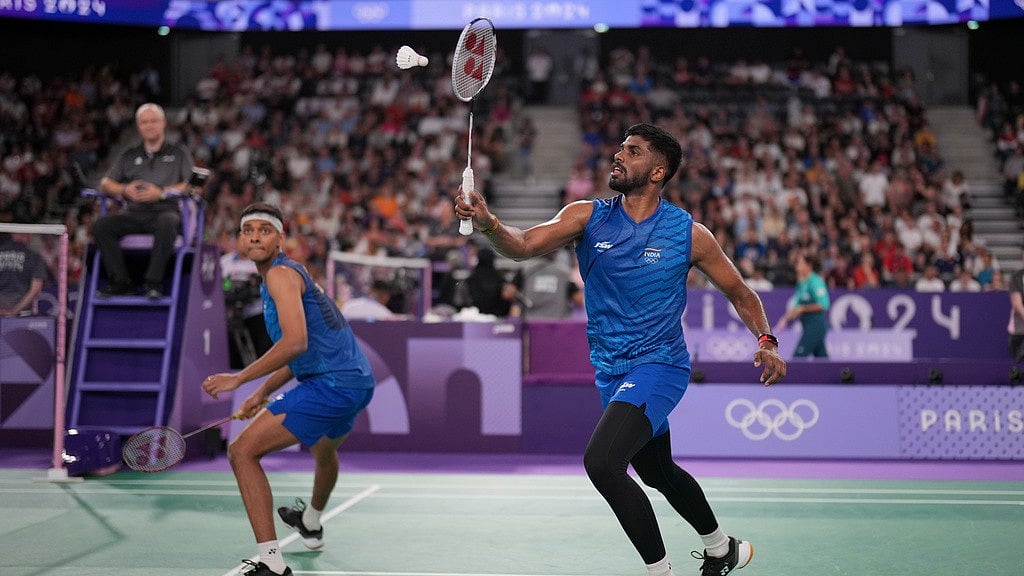 India's Satwiksairaj Rankireddy, right, and Chirag Shetty play against France's Lucas Corvee and Ronan Labar during their men's doubles badminton group stage match at Porte de la Chapelle Arena during the 2024 Summer Olympics, Saturday, July 27, 2024, in Paris, France. - AP/Dita Alangkara
