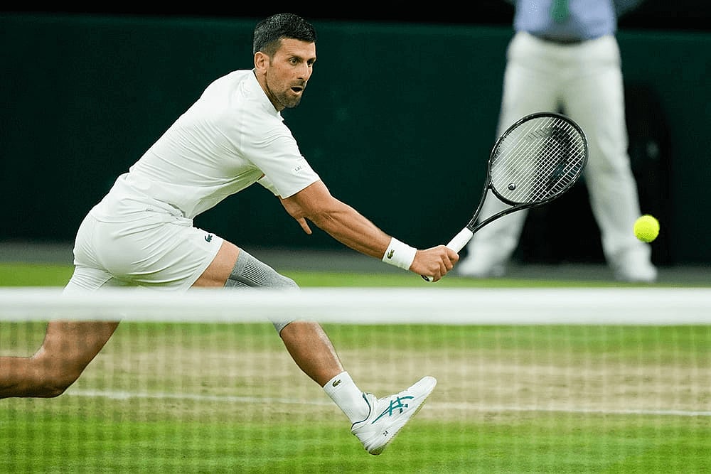 Novak Djokovic plays a return shot against Rune, Wimbledon 2024