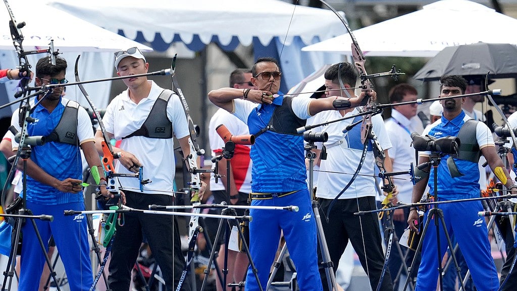 AP/Kin Cheung : India's Dhiraj Bommadevara, left, Tarundeep Rai, center, and Pravin Ramesh Jadhav, right, compete during the men's archery individual ranking round at the 2024 Summer Olympics, Thursday, July 25, 2024, in Paris, France.