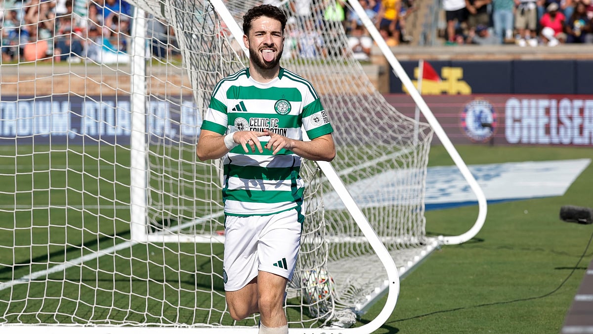 Celtic's Mikey Johnston celebrates scoring their fourth goal against Chelsea - null