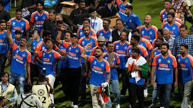 The triumphant Indian men's cricket team with the T20 World Cup trophy at Wankhede Stadium on Thursday (July 4). - AP/Rafiq Maqbool