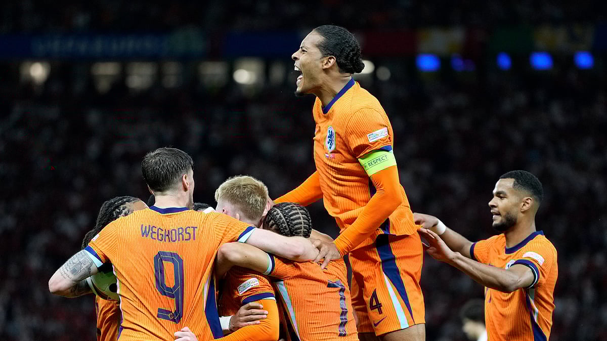 Virgil van Dijk of the Netherlands, up, celebrates after Stefan de Vrij of the Netherlands scored their sides first goal during a quarterfinal match. AP Photo
