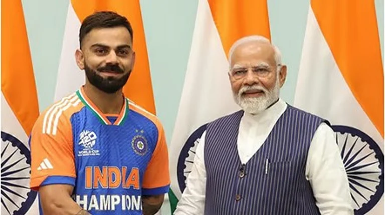 Prime Minister Narendra Modi with India cricketer Virat Kohli during a meeting after winning ICC T20 World Cup 2024, in New Delhi on Thursday (July 4). - PTI