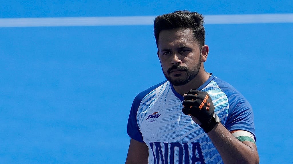 AP/Anjum Naveed : India's Harmanpreet Singh, center, celebrates after scoring a goal during the men's field hockey match between India and Argentina at the Yves-du-Manoir Stadium, at the 2024 Summer Olympics, Monday, July 29, 2024, in Colombes, France.