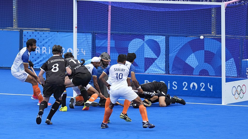 Photo: AP : India's Mandeep Singh (centre) scores their opening goal against New Zealand at the men's Pool B match of Paris Olympic Games 2024 on Saturday (July 27).