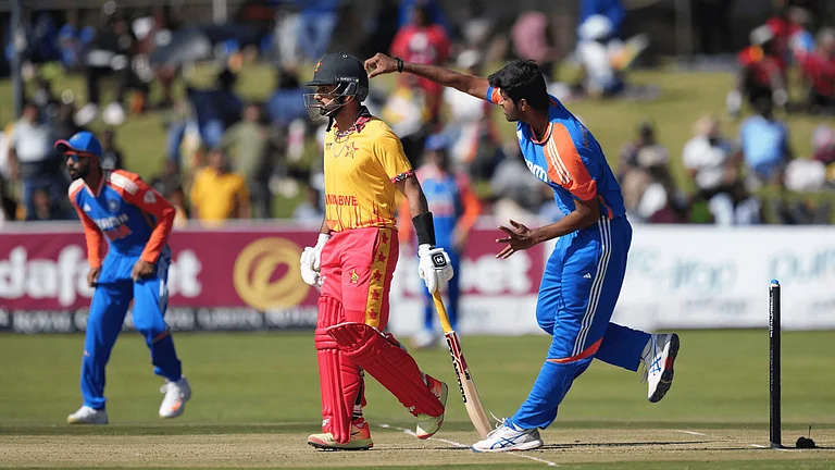 Washinton Sundar bowls in the third T20I against Zimbabwe - AP Photo/Tsvangirayi Mukwazhi