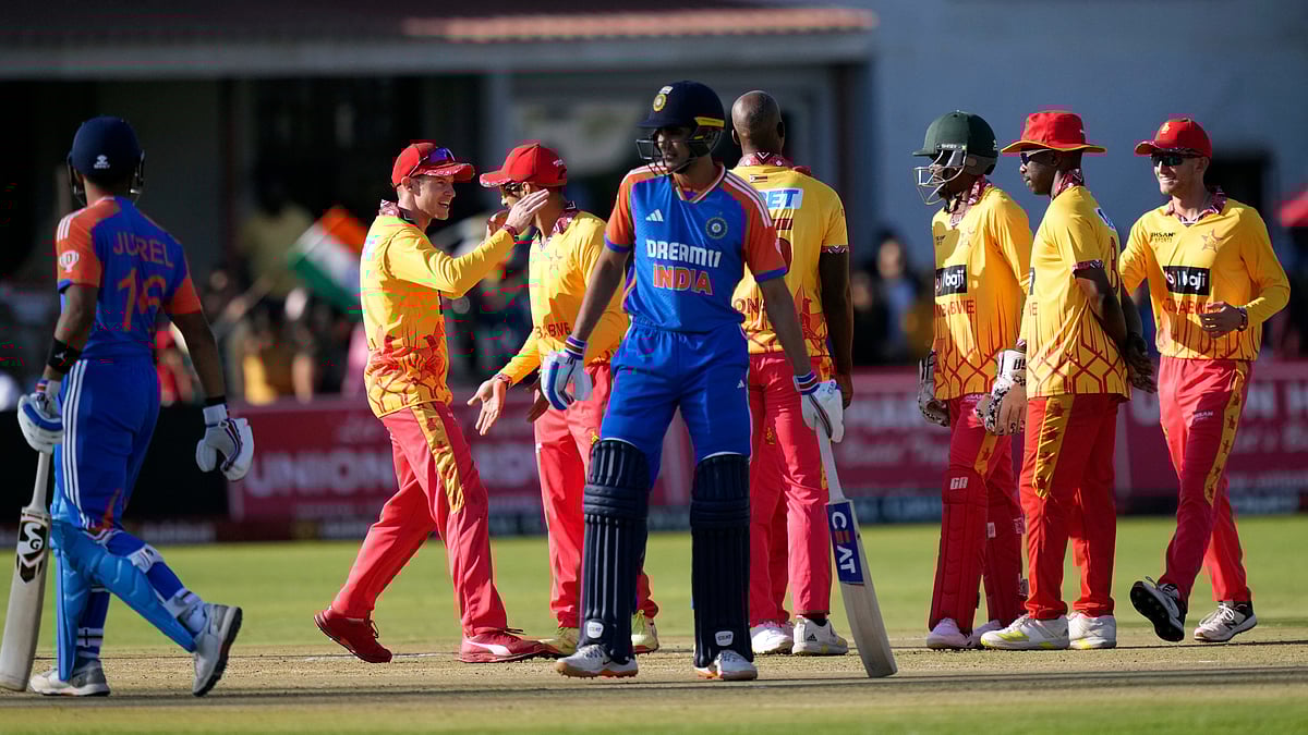 AP Photo/Tsvangirayi Mukwazhi : Zimbabwe players celebrate a wicket during the T20 cricket match against India at Harare Sports club.