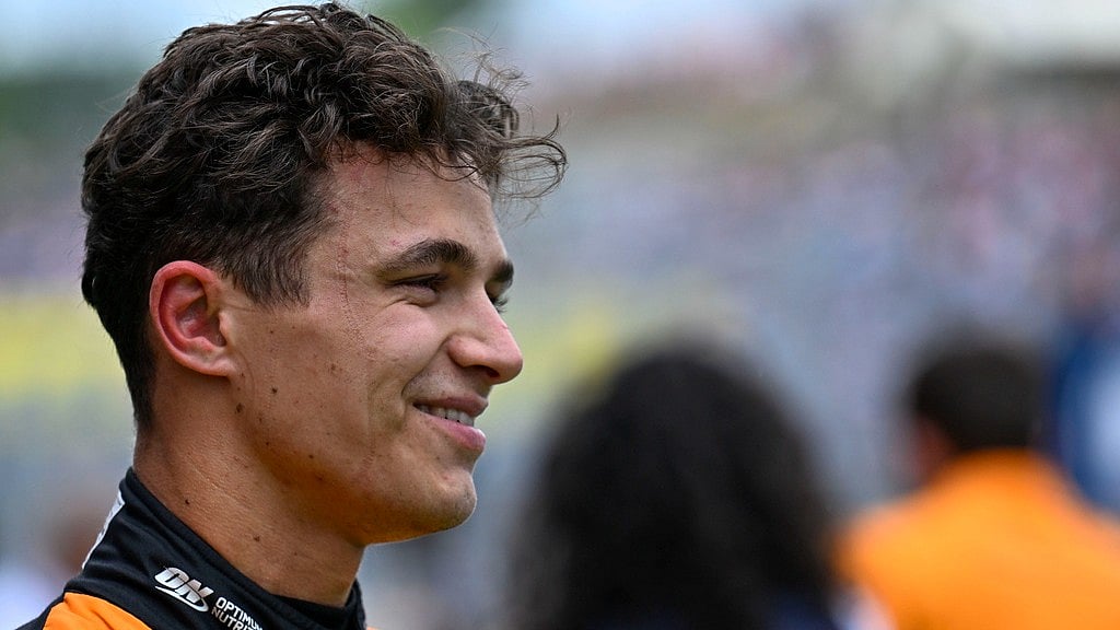AP/Denes Erdos : McLaren driver Lando Norris of Britain smiles after setting the pole position in the qualifying session ahead of Sunday's Formula One Hungarian Grand Prix auto race, at the Hungaroring racetrack in Mogyorod, near Budapest, Hungary, Saturday, July 20, 2024
