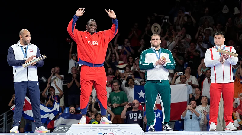 Mijain Lopez Nunez celebrates his historic victory in Paris