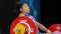AP/Kin Cheung : Mirabai Chanu Saikhom of India competes during the women's 49kg weightlifting event at the 2024 Summer Olympics, Wednesday, Aug. 7, 2024, in Paris, France.