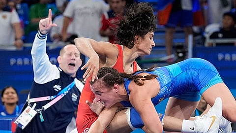 2024 Paris Olympics Games Vinesh Phogat in her semi-final bout with Woller Akos in the background.