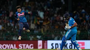 AP Photo/Eranga Jayawardena : Sri Lanka's Dunith Wellalage celebrates the wicket of India's captain Rohit Sharma during the third ODI cricket match between Sri Lanka and India in Colombo, Sri Lanka.