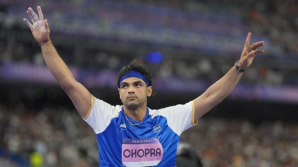 Photo: AP : Neeraj acknowledges spectators after securing silver medal at the men's javelin throw event of Paris Olympics 2024 on Thursday (August 8).