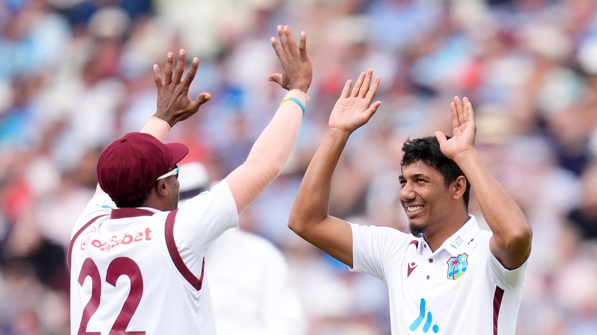 Photo: Nick Potts/PA via AP : West Indies Gudakesh Motie celebrates bowling out England's Joe Root during day two of the Third Rothesay Test match at Edgbaston, Birmingham.