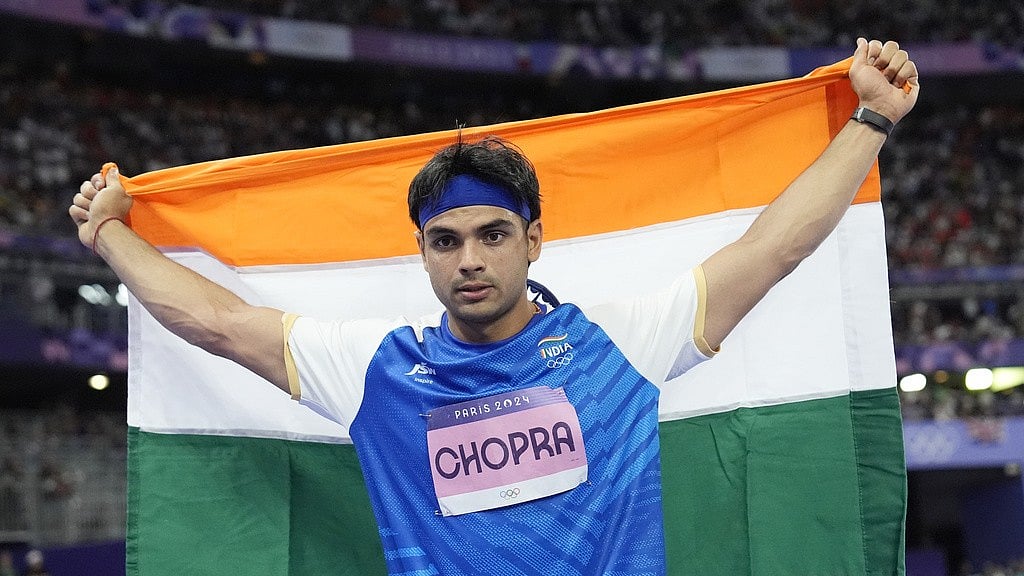 File : Neeraj Chopra celebrates after securing the silver medal at the men's javelin throw event of Paris Olympics 2024 on Thursday (August 8).