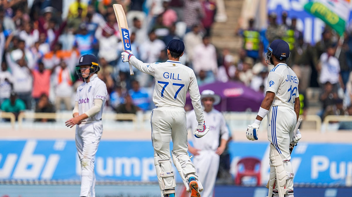 AP Photo/Ajit Solanki : India's Shubman Gill, center celebrates his fifty runs on the fourth day of the fourth cricket test match between England and India in Ranchi, India, 