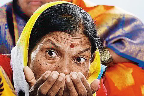 Basvalinga Pote shows how Dalits drink water using their hands