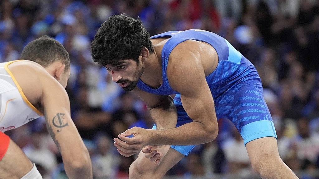Photo: AP : India's Aman Sehrawat in action against Puerto Rico's Darian Cruz during their freestyle 57kg bronze medal bout at the Paris Olympics on  Friday (August 9).