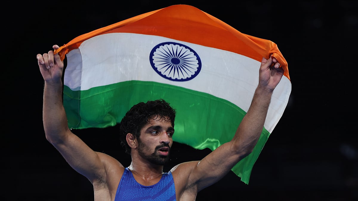PTI : India's Aman Sehrawat celebrates after clinching the men's freestyle wrestling 57kg bronze medal at the Paris Olympics.