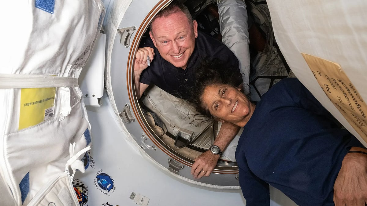 NASA’s Boeing Crew Flight Test astronauts (from top) Butch Wilmore and Suni Williams inside the vestibule between the forward port on the International Space Station’s Harmony module and the Starliner spacecraft. - NASA