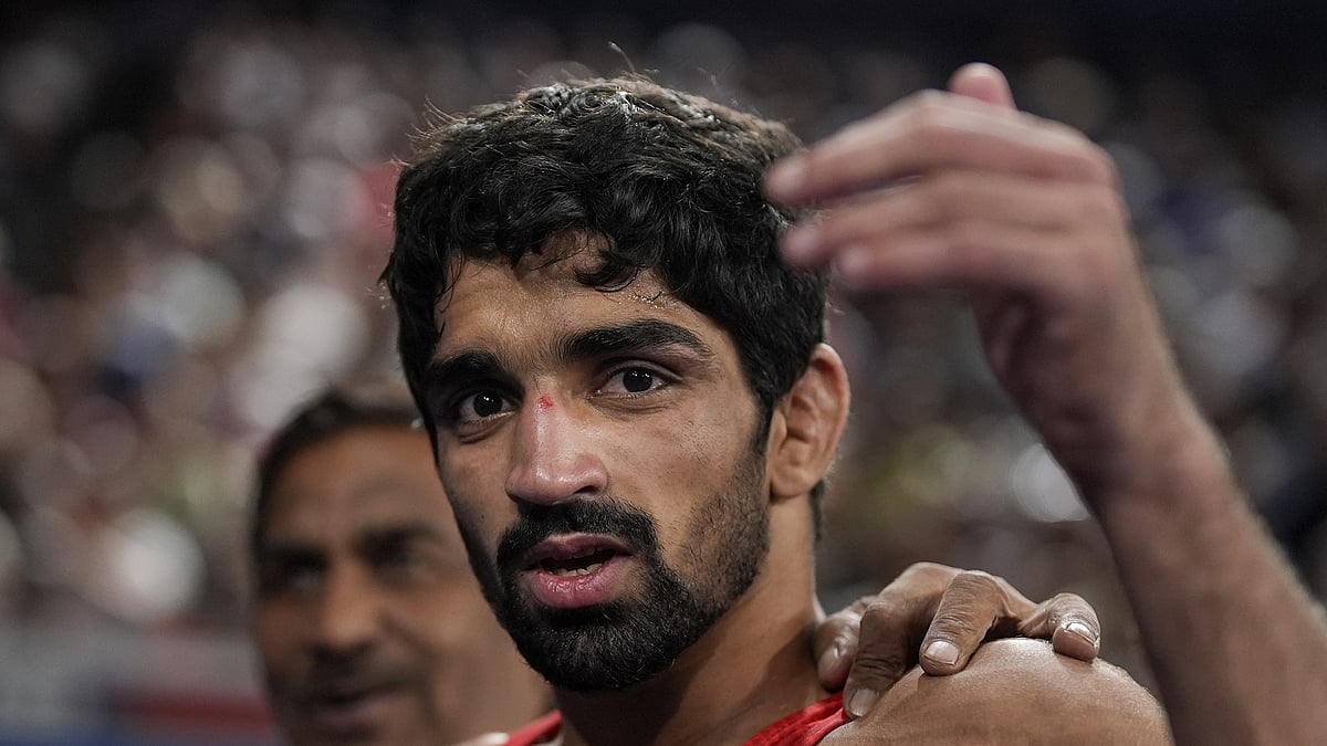 PTI : Aman Sehrawat reacts after winning his men's freestyle 57kg wrestling quarter-final bout against Albania's Zelimkhan Abakarov at the Paris Olympics.