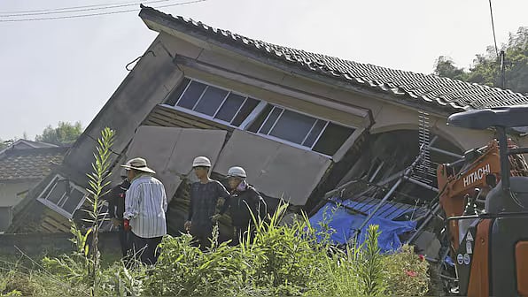 A collapsed house in Japan after yesterdays massive earthquake 