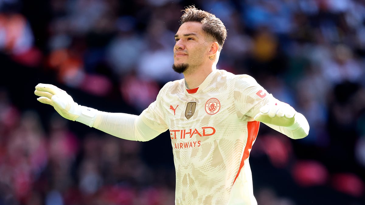 Ederson celebrates after scoring a penalty in Manchester City's Community Shield win. - null