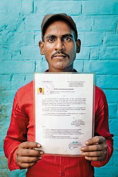 Free, At Last  
Govind Paswan, a former bonded labourer from Sitamarhi, Bihar, shows his release certificate. After rehabilitation, Paswan has now become a ward member in his Panchayat
