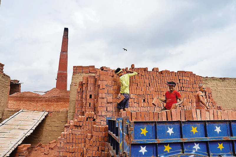 Brick kiln workers loading bricks in Patna
