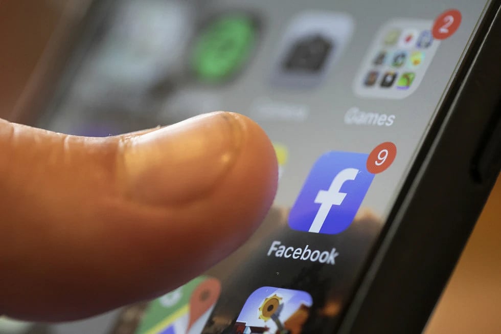 AP : An iPhone displays the Facebook app  in New Orlean.(Representational image) |