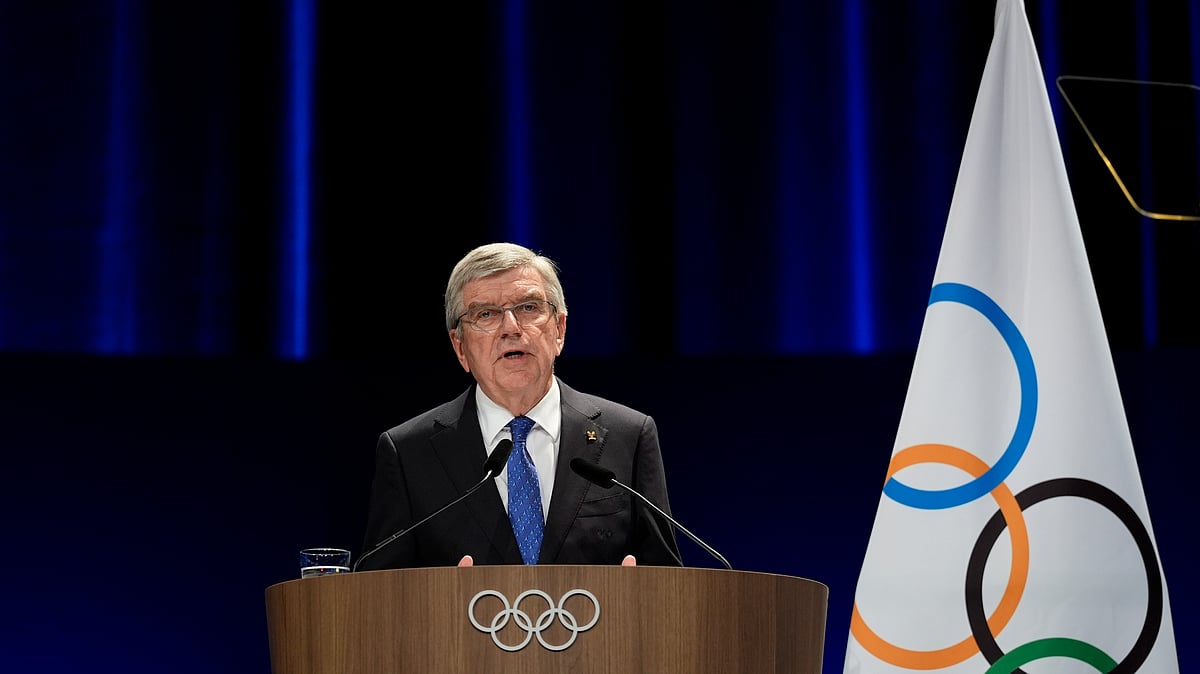 AP Photo/Ariana Cubillos : IOC President Thomas Bach addresses the audience during the 142nd IOC session at the 2024 Summer Olympics, on Saturday.