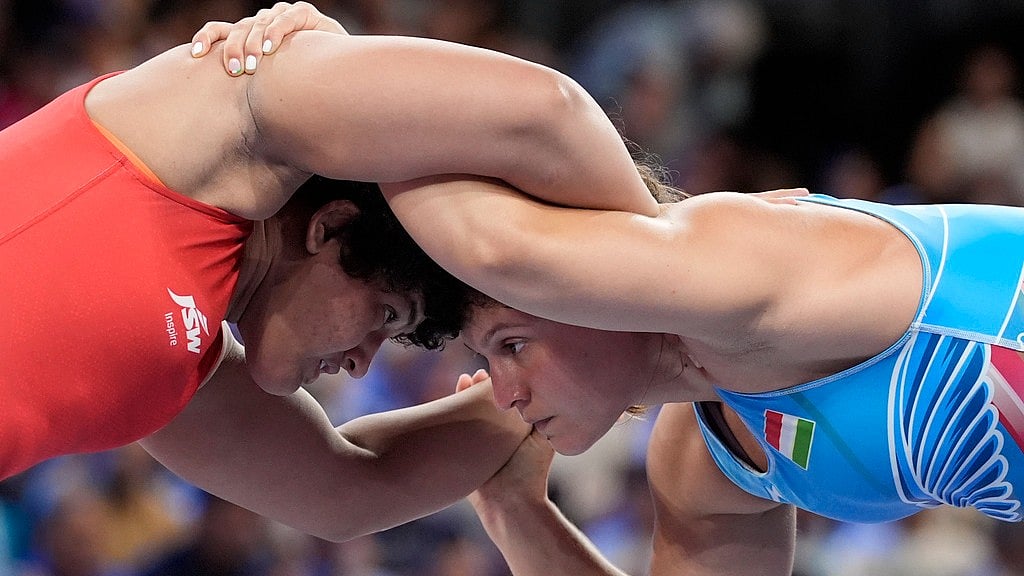 AP/Eugene Hoshiko : India's Reetika Hooda during her Round of 16 tie.