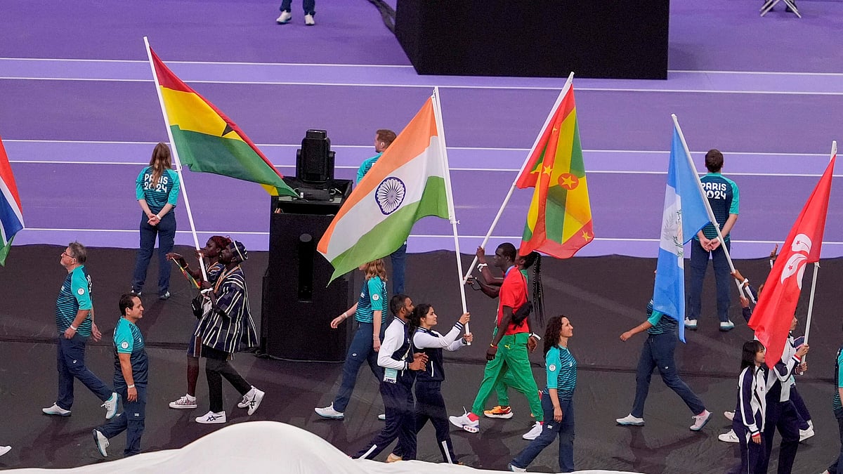 PTI Photo/Ravi Choudhary : India's flag-bearers shooter Manu Bhaker and men's hockey team goalkeeper PR Srejeesh and others during the closing ceremony of the 2024 Summer Olympics at Stade de France, in Paris.