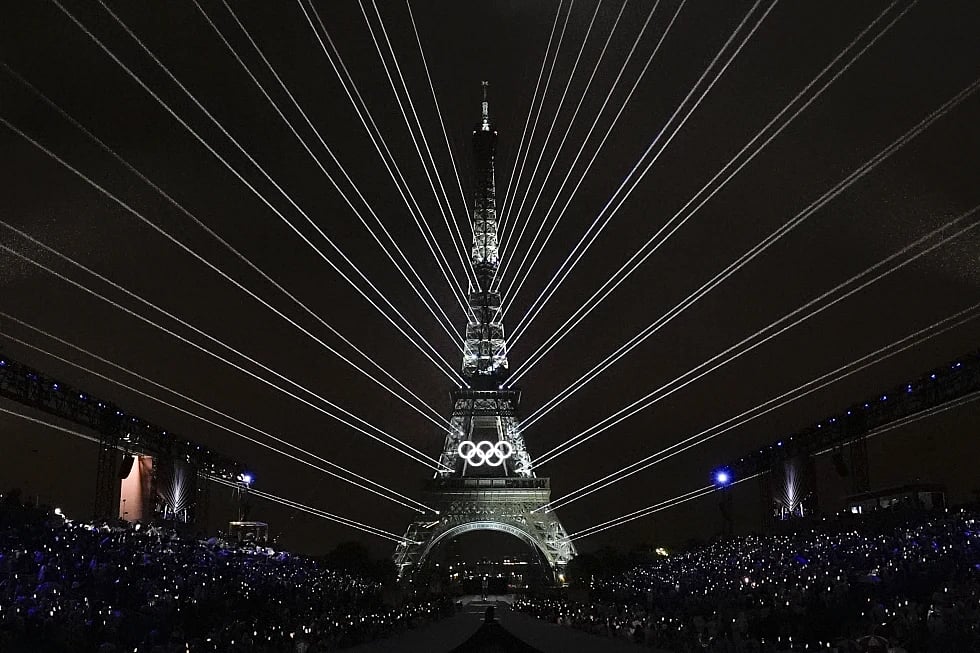 A light show is projected from the Eiffel Tower in Paris, France |