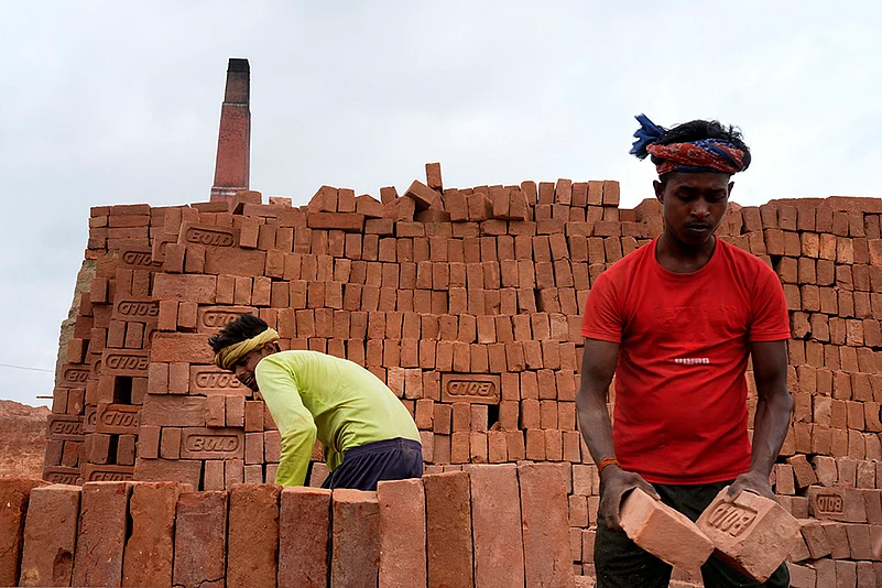 Brick Kiln workers near Patna loading bricks in a truck.